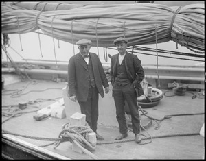 Schooner captain Ben Pine and unidentified man on deck. Vessel is possibly "Gertrude L. Thebaud."