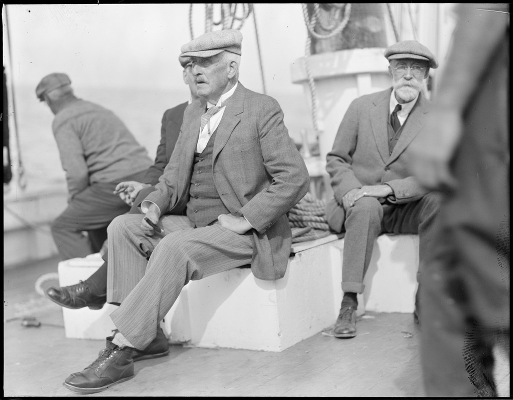 Capt. Blackburn and Capt. Louis Thebaud aboard the fishing schooner Gertrude L. Thebaud in Gloucester. Blackburn sailed a dory across wintry ocean, freezing his hands and feet badly.