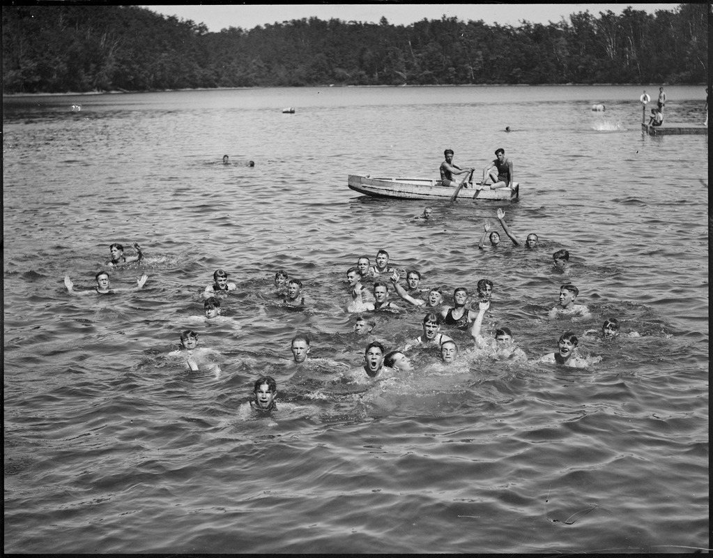 Boys swimming in lake