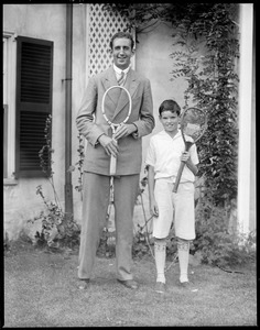 G. Lyttleton Rogers, Irish Davis Cup star, holding new racquet and Johnny Palfrey holding the old, at Longwood