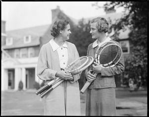 Two women with tennis rackets