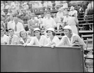 Women players in stands, ready to play