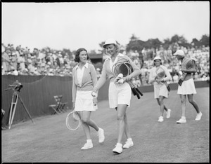 Women players talking on court
