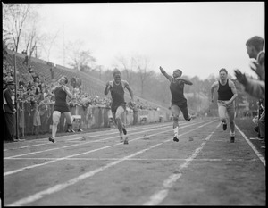 Runners at the finish line, high school track meet