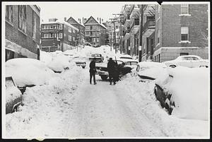 Digging out on Frawley St Rox. Cars have trouble going up Frawley St. on Parker Hill Rox.