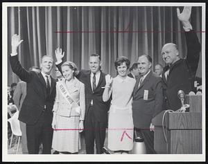 Winner Without Losers - Unopposed candidates return the cheers of the delegates who nominated them by acclamation. From left, Secretary of State Kevin White, Mrs. White, Treasurer Robert Crane, Mrs. Crane, convention chairman John F. X. Davoren, and State Auditor Thaddeus Buczko.