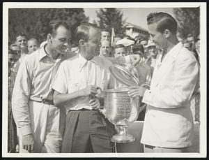 PGA Cup to Champ The Professional Golfers' Association cup for 1938 went to Paul Runyan (center) at Shawnee on the Delaware, Pa., July 16, after Runyan defeated Sam Snead 8 and 7 (left). The cup was presented by George Jacobus, PGA president (right).