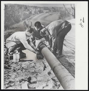 Workers working on pipeline, possibly in Leominster, Massachusetts