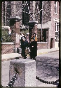 People gathered at the entrance to the courtyard of the Old North Church