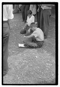 Two boys looking at a knife