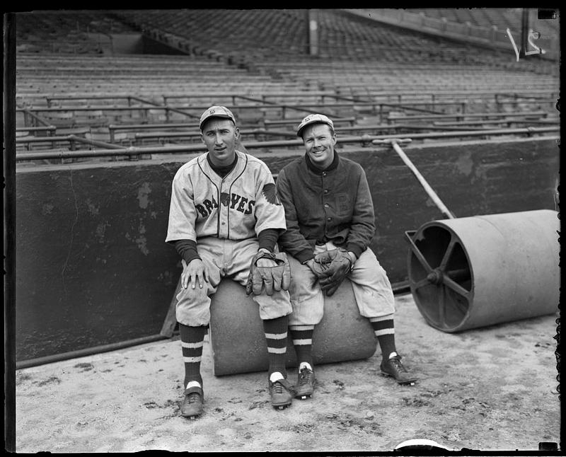 Boston Braves players sitting on turf roller