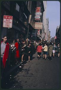 Crowd waiting outside Paramount Theater, Boston, for closed-circuit Beatles show