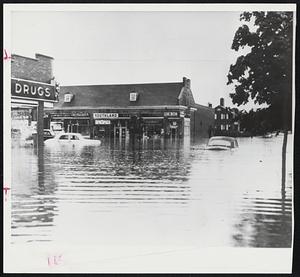 Let's Hope the future activities of Hurricane Connie are kinder to New England than they have been elsewhere on the Atlantic seaboard. Below, water covers the area around 250th Street and Union turnpike in Bellerose, Queens, N. Y., as heavy rain pelts the New York metropolitan area.