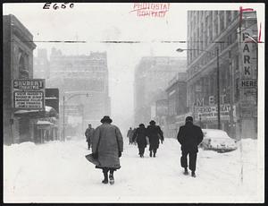 Theater District pedestrians found they had Tremont street to themselves as they headed for Boylston street MTA station and the city's only sure method of transportation. Automobile traffic was almost non-existent throughout the city.