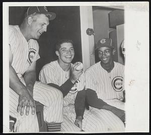 Dick Drott, center, Cubs rookie and Cincinnati native, struck out 15 Braves yesterday in posting a 7-5 victory. His Chicago teammates and fans were delighted, naturally, but so were his old Cincinnati friends and neighbors. Flanking him on the left is outfielder Walt Moryn and on the right is Ernie Banks. Their home runs played key roles in Chicago’s first-game victory.