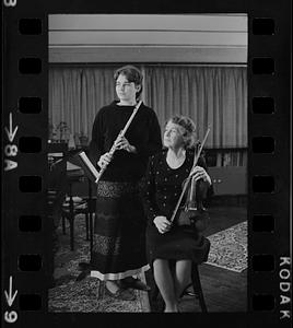 Florence Chapman Pearson seated with violin and Lea Pearson with flute