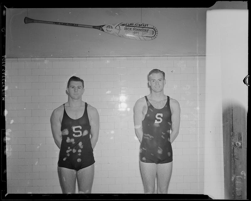 Two swimmers in pool locker room