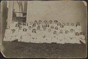 Young girls dressed in white for graduation or communion