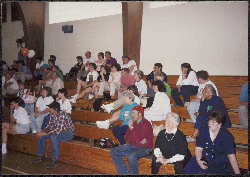 Lady Wildcats Basketball game with fans in the bleachers