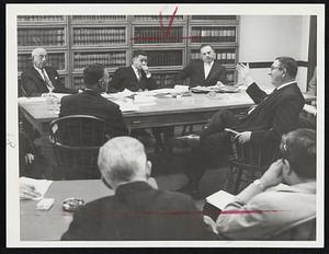 Key Witness Explains to finance commission details of 1950 "auction" of Hyde Park mystery land. Herman Corp (right, gesturing) tells of land sale. Others, at table (clockwise): Atty. Joseph J. Gottlieb (back to camera) counsel for Carp; Fin Com members Maxwell Grossman, Edward W. Brooke and Dr. Roger Abizaid.