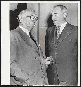 Acheson. Secretary of State Acheson (right) talks with Sen. Walter F. George (D. Ga.) as the cabinet officer arrives to answer questions about the administration's big foreign aid program before the Senate foreign relations committee. President Truman has asked for $7,900,000,000 in aid.