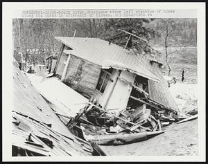 Rogue river left wreckage of homes along its banks in aftermath of floods.