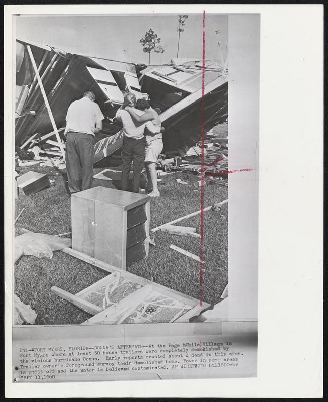 Donna's Aftermath--At the Page Mobile Village in Fort Myers where at least 50 house trailers were completely demolished by the vicious Donna. Early reports counted about 4 dead in this area. Trailer owner's foreground survey their demolished home. Power in some areas is still off and the water is belied contaminated.