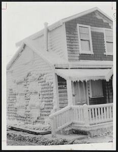 Scituate White House is the result of frozen ocean spray thrown up by wild winter tides. This crusty cottage is located on Lighthouse Rd. in the Sand Hills section.