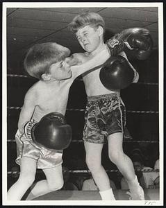 Bob Kelly, left, tags Rick Connolly in 100 lb class, annual fights sponsored by McKeon post A.L. Dor. at Florian Hall, Dor.