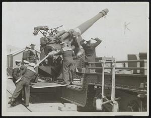 With the British Navy in War Time. 414. Anti Aircraft Gun at an English coast town. Loading.