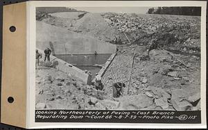 Contract No. 66, Regulating Dams, Middle Branch (New Salem), and East Branch of the Swift River, Hardwick and Petersham (formerly Dana), looking northeasterly at paving, east branch regulating dam, Hardwick, Mass., Aug. 7, 1939