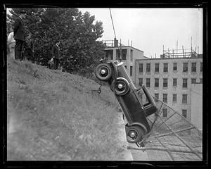 Fence keeps car from falling, Brookline