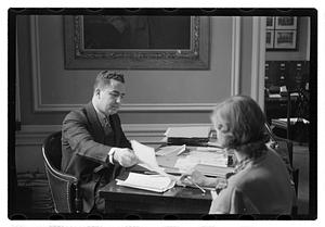 A man seated at a desk