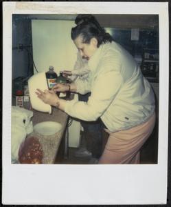 Woman emptying a bowl
