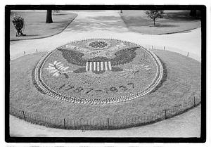"1787-1937" floral design of the Great Seal of the United States in front of Ether Monument, Public Garden