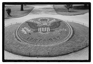 "1787-1937" floral design of the Great Seal of the United States in front of Ether Monument, Public Garden