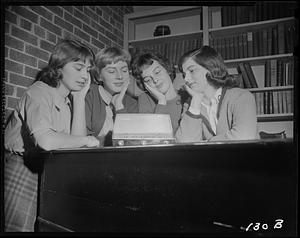 Four women listening to radio