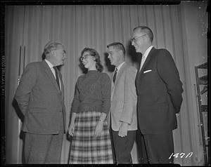 President Glenn Olds with students and other man