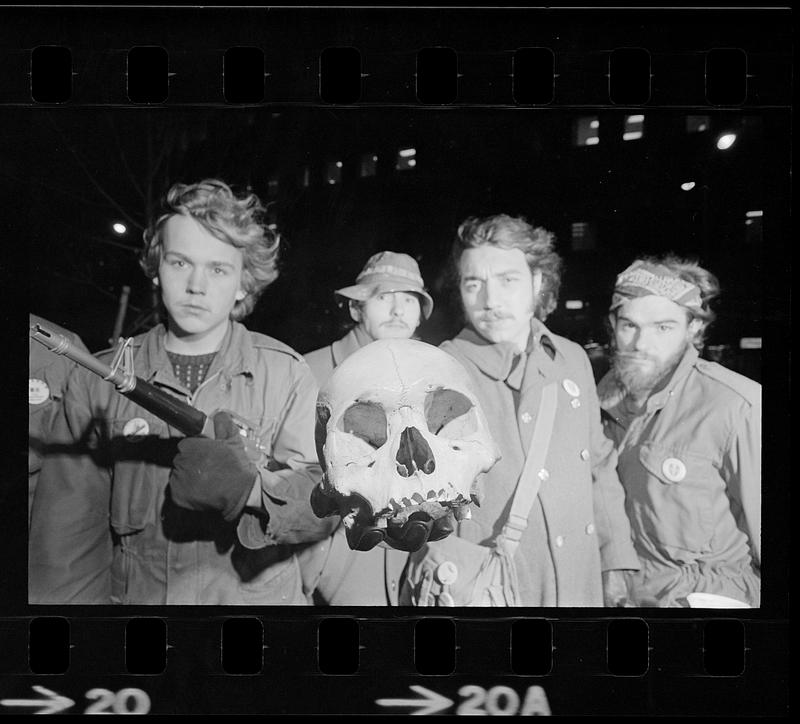 Anti-war demonstrators with human skull, Government Center