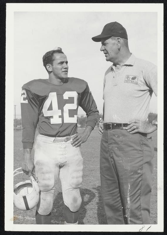 Boston University Coach Steve Sinko (right) talks things over with substitute halfback Dick Desmarais is regard to today's game with Navy at Boston University Field. Desmaris should see plenty of action in the contest.