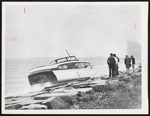 Spectators watch helplessly as grounded cabin cruiser Beanie is pounded on rocks by waves near the Savin Hill Yacht Club in Dorchester.