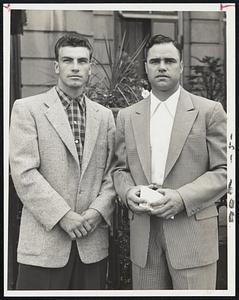 White Sox Newcomer is Catcher Darrell Johnson (left) shown with veteran outfielder Tom Wright, a former member of the Red Sox, before leaving for Fenway Park and the opening game of their series with the Red Sox this afternoon.