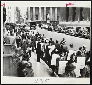 Pickets Parade Before Big Board – Pickets march before the Broad street side of the New York Stock Exchange after the United Financial Employes (AFL) yesterday went on strike against the Big Board and New York curb exchange.