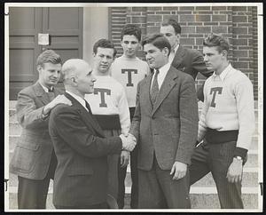 Tufts Coach Leaves for Army- Samuel Ruggeri, Coach of Wrestling at Tufts for 18 years left yesterday for the Army where he will be a First Lieutenant in the Military Police. Here the Tufts boys say Goodbye to a swell friend and coach on the steps of the Cousens Gymnasium on the Tufts College campus. (l-r) William Wells of Great Barrington; Sanford Freedman of Lawrence; Paul Slate of Quincy; Douglas Pote of Medford; Lee Hopkins of S. Weymouth and Capt. Hayden Ringer of Brookline shaking hands with Coach Ruggeri.