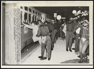 Rebellious Students Arrested-- Police frisk students at the University of Michigan in Ann Arbor early after they were taken from a classroom building where they had spent the night in a demonstration, The demonstration stemmed from a dispute over who should control a proposed university book store.