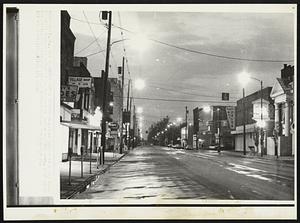 Quiet Under Curfew--downtown street in Kent, Ohio is quiet, Monday night curfew was declared. Kent State University has been the site of demonstrations for three days