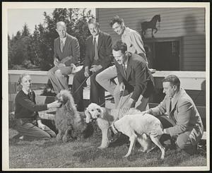 Why These Dogs are Good and others are not is the goal of research being conducted by these scientists at Bar Harbor, Me. They are members of the staff of the Hamilton Station of the Jackson Memorial Laboratory investigating mammal genetics. From left to right the scientists are, back row, Dr. Calvin H. Hall of Western Reserve University, psychologist; Dr. Clarence Cook Little, director of the Laboratory and noted cancer researchist; and Dr. John L. Fuller of the University of Maine; front row, Miss Edna DeBuis of New Jersey; Dr. John Paul Scott, behavior studies at the laboratory; and Dr. Benson Ginsburg of the University of Chicago.