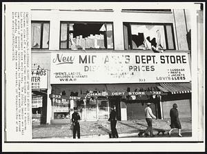 Sidewalk Closed After Los Angeles Quake -- Policemen close off a sidewalk after earthquake damage to a downtown Los Angeles department store early today. The jolting temblor was felt over miles of southern California, but damage was worst in and around Los Angeles. Several deaths were reported.