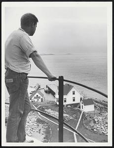 Not Wheat-fireman-apprentice Norman J. Kaufer of New Albany, Indiana, stares out at miles of rolling ocean, on watch at Boston Light.