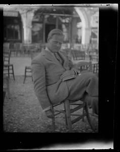 Unidentified man at outdoor cafe, Greece
